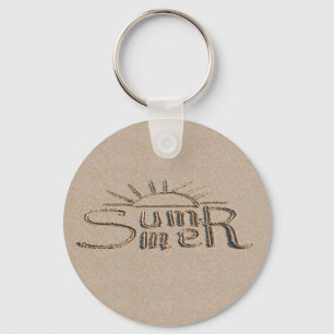 Summer sign carved on the beach sand key ring
