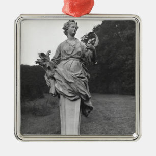 Summer, statue in the gardens metal tree decoration