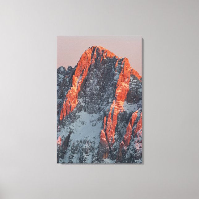 Sun light on snowy mountains canvas print (Front)
