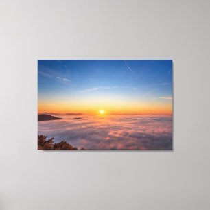 Sun peaking above clouds in the morning canvas print