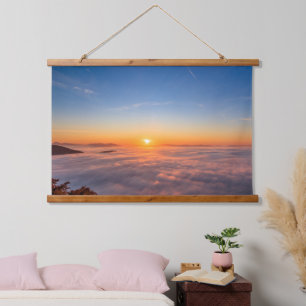Sun peaking above clouds in the morning hanging tapestry