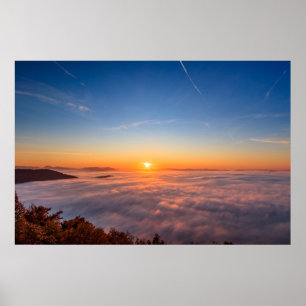 Sun peaking above clouds in the morning poster