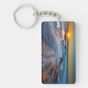 Sun rays illuminate the Pacific Ocean Key Ring
