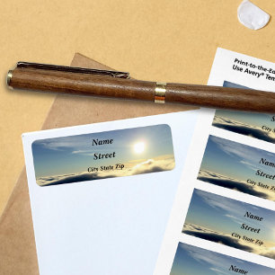 Sun rising above the clouds over Colorado Springs.