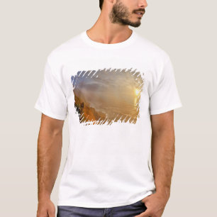 Sun sets over the Pacific Ocean from Heceta T-Shirt