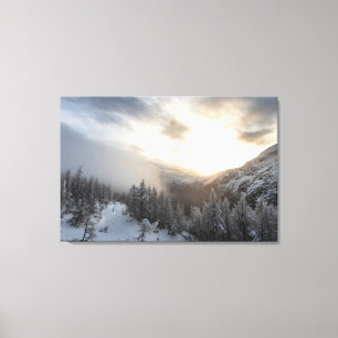 Sun shining at stunning winter scenery canvas print
