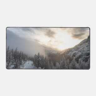 Sun shining at stunning winter scenery desk mat