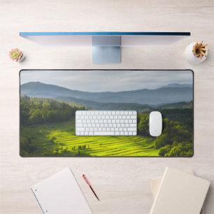 Sun shining on field of terraces desk mat