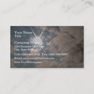 Sunburst through white clouds business card