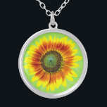 Sunflower Bold Floral Yellow and Green Flower Silver Plated Necklace<br><div class="desc">This cute summer floral design has a bold sunflower blossom in full bloom. It's made in shades of bright yellow, vivid orange and brown and green on a slightly distressed / grunge summery green background. The big flower has a painted look. If you love gardens and flowery motifs, you'll love...</div>