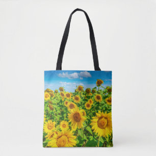 Sunflower field in summer sunny day. Picturesque l Tote Bag