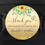 Sunflower gold glitter thank you wedding  classic round sticker<br><div class="desc">A faux gold background,  decorated with a sunflower and eucalyptus greenera and golden sparkles.   With the text: Thank you for sharing our special day,  with a small heart.   Personalise and add your names.</div>