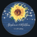 Sunflower Navy Babys Breath Lights Wedding Classic Round Sticker<br><div class="desc">These wedding stickers feature a rustic sunflower, babys breath flowers and string lights on a navy blue wood grain background. Personalise these stickers with your names and wedding date. These stickers are part of a collection which includes matching wedding stationery and gifts. Please visit the collection pages in our store...</div>