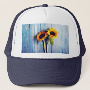 Sunflower on Blue Wood Wall Trucker Hat