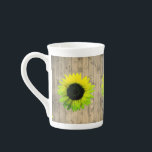 Sunflower on Rustic Wood Bone China Mug<br><div class="desc">On this enchanting bone china mug are neon shades of green and yellow sunflowers on a rustic wood planks backdrop creating a country charm to spice up any kitchen decor.</div>