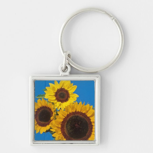 Sunflowers against blue fence key ring (Front)