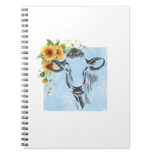Sunflowers and cow on notepad notebook