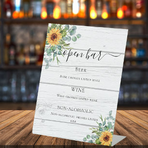 Sunflowers eucalyptus greenery wood bar menu pedestal sign