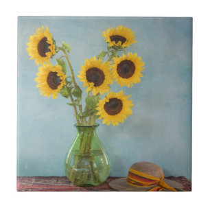 Sunflowers in vase on table tile