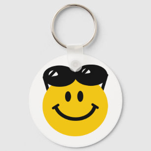 Sunglasses perched on top of head face key ring