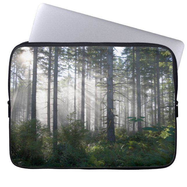 Sunlight Breaking Through a Misty Forest Laptop Sleeve (Front)