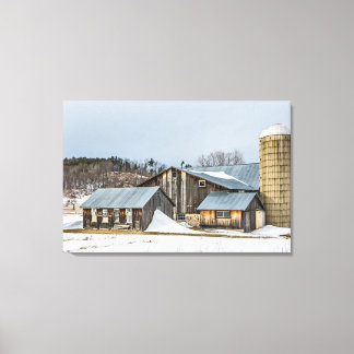 Sunlit Barns and Silos in Winter Canvas Print