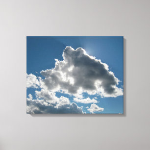 Sunlit Clouds Under Open Sky Canvas Print