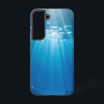 Sunlit Coral Reef Tough Phone Case<br><div class="desc">Dive into the breathtaking beauty of a sun-drenched underwater world every time you pick up your phone. This stunning phone case features a vibrant image of brilliant sunbeams piercing through clear blue water, illuminating a thriving coral reef teeming with colourful fish. The unique perspective looking up towards the surface with...</div>