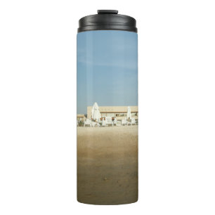 Sunny Resort Beach with White Loungers and Blue Sk Thermal Tumbler