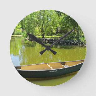 Sunny Summer Day with Canoe on the Water. Round Clock