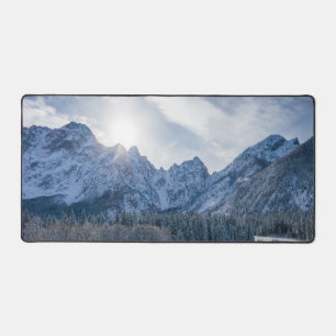 Sunny winter day at snowy frozen lake Fusine Desk Mat