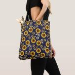 Sunny Yellow Gold Navy Sunflowers Leaves Pattern Tote Bag<br><div class="desc">This elegant and chic floral pattern is perfect for the summer season. it features a yellow and brown watercolor painted sunflower pattern with faux printed gold foil leaves on top of a simple navy blue background. This print is trendy, country, and modern. ***IMPORTANT DESIGN NOTE: For any custom design request...</div>