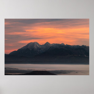 Sunrise behind majestic mountains poster