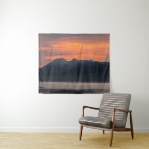 Sunrise behind majestic mountains tapestry