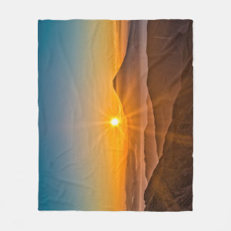 Sunrise between the hills fleece blanket