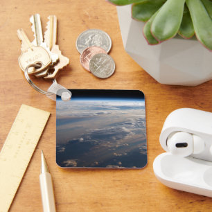 Sunrise Casts Long Shadows Over Philippine Sea Key Ring