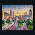 Sunrise Cityscape Building Atlanta Georgia Travel Jigsaw Puzzle<br><div class="desc">This scenic jigsaw puzzle features a sunset over Atlanta with the skyscrapers and the Southern Expressway traffic in the foreground #travel #adventure #atlanta #georgia #building #architecture #sunrise #sunset #city #skyline #skyscrapers #colourful #landscape #jigsaw #puzzle #jigsawpuzzle #gifts #gift #fun #stockingstuffers #games</div>