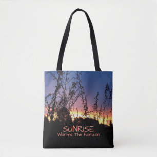 Sunrise Glows Between Wildflower Silhouettes Tote Bag