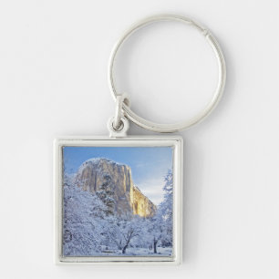 Sunrise light hits El Capitan through snowy Key Ring