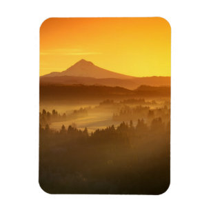 Sunrise orange colours the fog in the valley in magnet