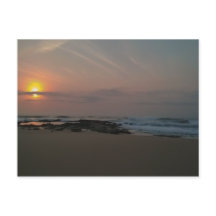 Sunrise over a rockpool at the seaside