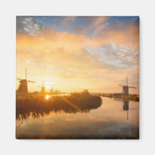Sunrise over windmills and a river in Holland Magnet