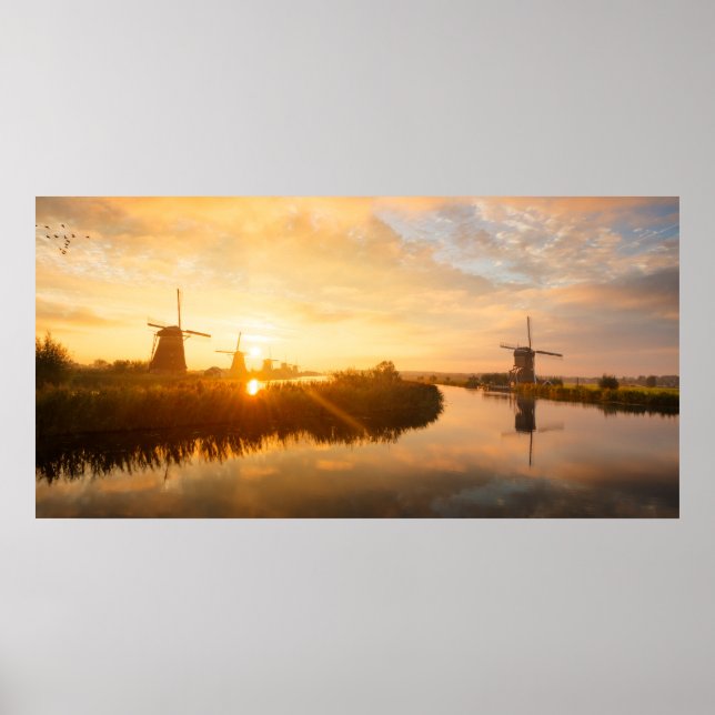 Sunrise over windmills and a river in Holland Poster (Front)