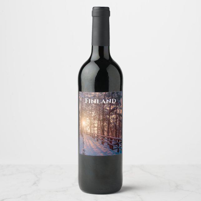 Sunset in snowy pine forest with sun ray wine label (Front)