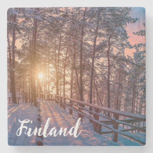 Sunset in snowy pineforest with sun ray stone coaster