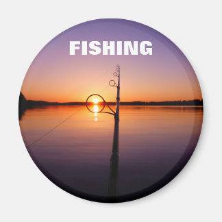 Sunset on a summer lake seen through a fishing rod magnet