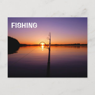 Sunset on a summer lake seen through a fishing rod postcard