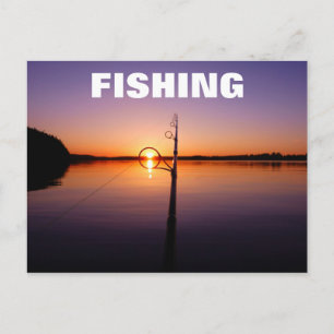 Sunset on a summer lake seen through a fishing rod postcard