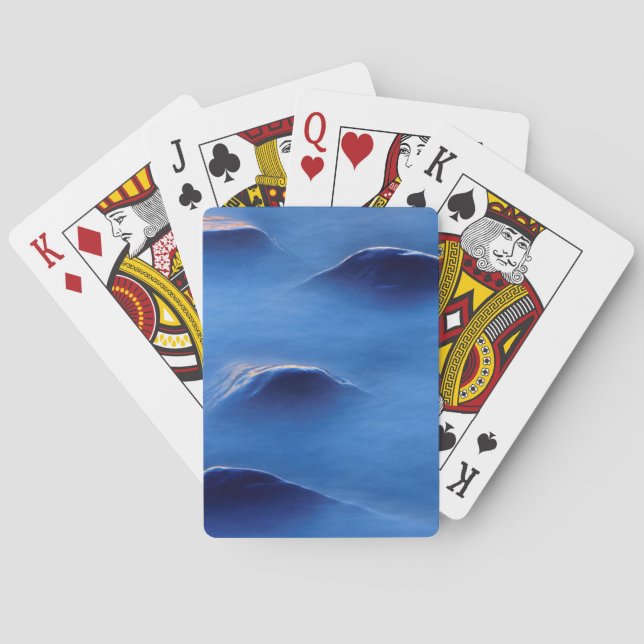 Sunset on rocks protruding through foamy water playing cards (Back)