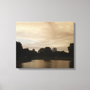 Sunset over a pond canvas print